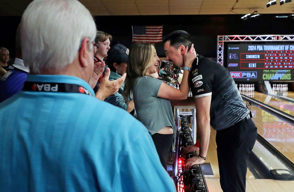 Sports Feature - HM - Cassandra Daleski (left) embraces her boyfriend Marshall Kent after he beat Anthony Simonsen to win the 2024 PBA Tournament of Champions at AMF Riviera Lanes in Akron. (Jeff Lange / Akron Beacon Journal)