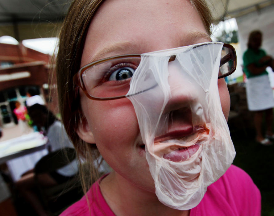 Feature - 3rd place - Emily Nelson, of Worthington, reacts to the bubble gum blow up on her glasses at the State Fair Bubble Gum contest . (Eric Albrecht / The Columbus Dispatch)