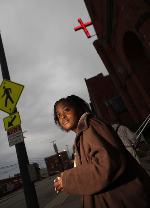 General News - 2nd place - Qwennita Frazier, 22, originally of Memphis, looks at a friend as they called her name outside the Faith Mission shelter on Long Street on Wednesday. She had just finished dinner and will be staying the night at the shelter.  (Jonathan Quilter / The Columbus Dispatch)