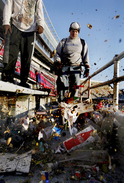 General News - 3rd place - ROTC crew members Andrew Melnyk (right), of Northwood, Ohio and Nathan Shubick of Columbus  clean the bleachers with a blower at Ohio Stadium. (Eric Albrecht / The Columbus Dispatch)