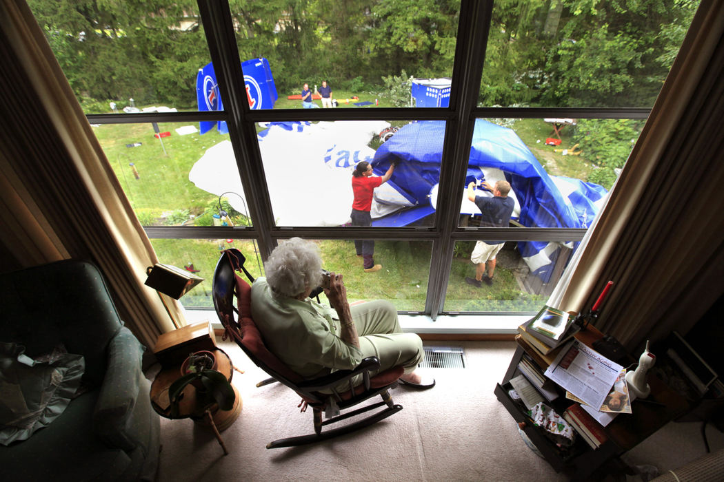 Spot News - 1st place - Lillian Bernhagen, 94,  who had a the "Hanger(1) Vodka" blimp crash in her back yard overnight. She was home alone when the blimp broke free from its moorings at Don Scott Field and crashed into her house and backyard.ISO 400f/5.6 1/160 sec (Jeff Hinckley / The Columbus Dispatch)