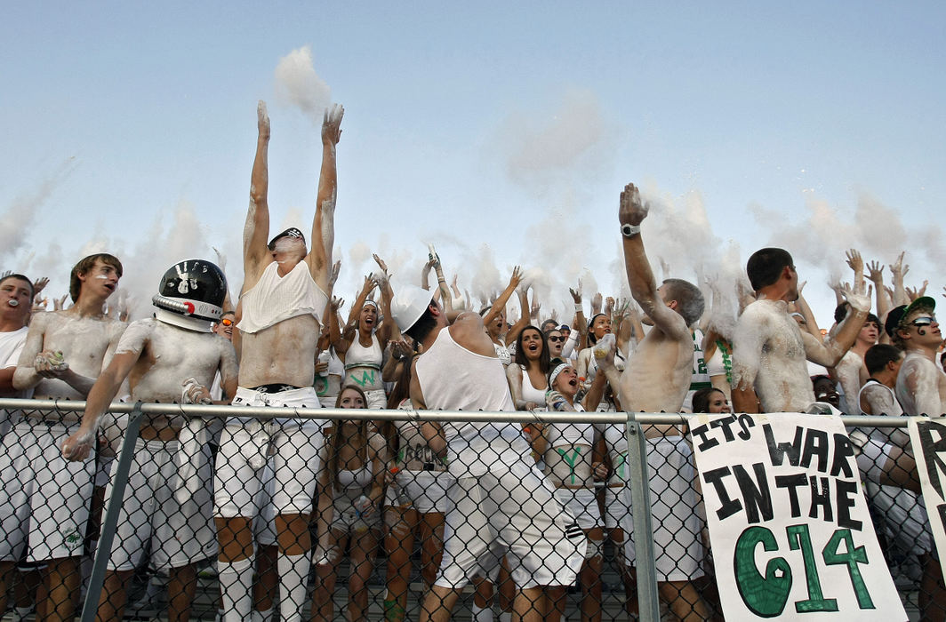 Sports feature - 1st placeDublin Coffman student section throws baby power up in the air at the start of their game against Dublin Jerome. (Kyle Robertson / The Columbus Dispatch)