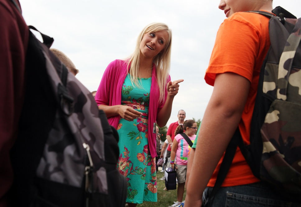 Story - HMFirst year teacher Amanda Chapman talks to some of the boys before the start of school.  (Eric Albrecht / The Columbus Dispatch)