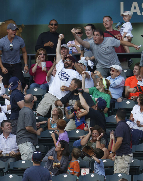 Sports Feature - 3rd placeFans react as one fan catches a Clippers foul ball in the bottom of the third inning at Huntington Park in Columbus. (Eamon Queeney / The Columbus Dispatch )