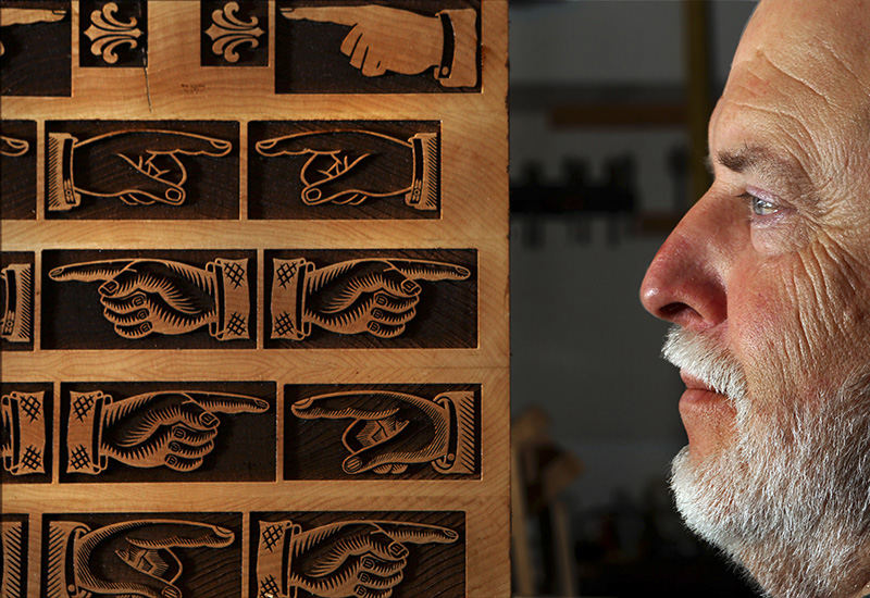 Portrait - 2nd place - Scott Moore of Gahanna creates wood type for letter press printers around the world. One of his favorite pieces that his has created for printers is the classic manicle wood block (finger pointing). (Eric Albrecht / The Columbus Dispatch)