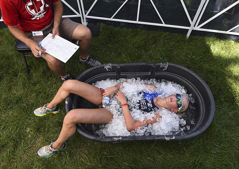 Sports Feature - 2nd place - Ulrika Brameus of Mckinney, Texas soaks in an ice bath after crossing the finish line at the USA Triathlon Youth Elite National Championship race at Voice of America Park in West Chester. (Erik Schelkun / Elsestar Images)