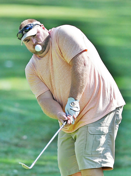 Sports - 3rd place - John Doughton III of Hubbard chips onto the green of the 16th hole during the Greatest Golfer of the Valley tournament at Mill Creek Golf Course. (Jeff Lange / The (Youngstown) Vindicator)