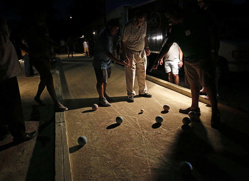 AStory - 1st place - Often heated discussions take place about scoring during the Columbus Italian Club's annual bocce tournament at their headquarters in Grandview Heights. In this instance, no one had to break out the tape measure to determine points.  (Adam Cairns / The Columbus Dispatch)