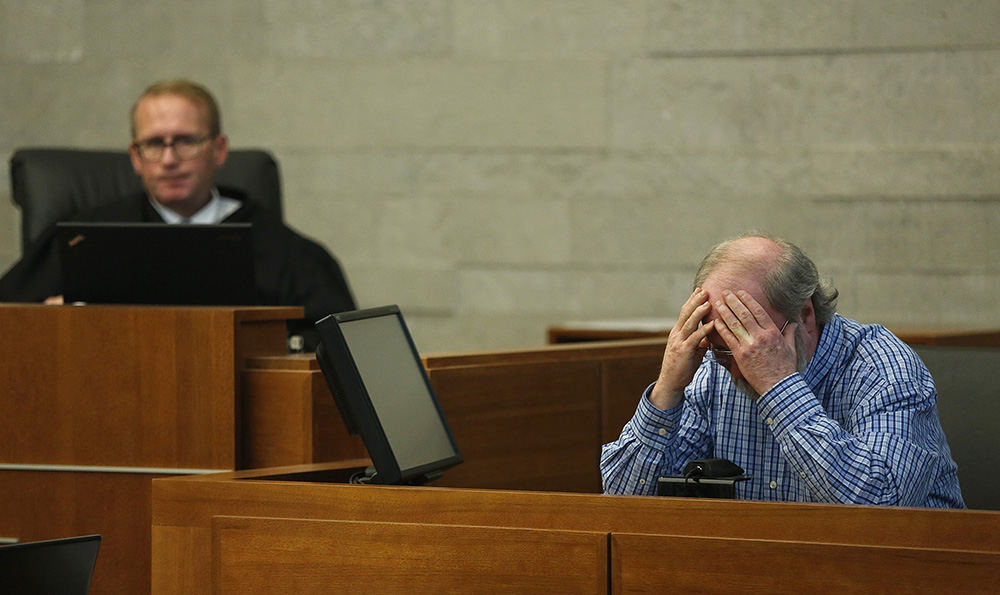 General News - 2nd place - Terrance Trent reacts on the witness stand while being questioned by his attorney, Steve Dehnart, about the moment he realized he was responsible for the accident that killed two people at the intersection of Broad and High.. Judge David C. Young is at left.  (Jonathan Quilter / The Columbus Dispatch)