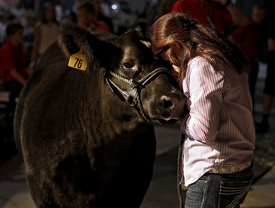 General News - 3rd place - Brooke Egbert of Auglaize County tears up while showing the Grand Champion Market Beef during the 2016 Ohio State Fair Sale of Champions.  The market beef was sold for $45,000.  (Kyle Robertson / The Columbus Dispatch)