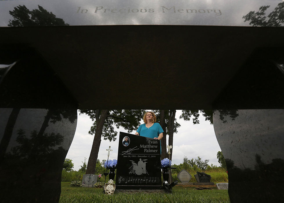 Portrait - 2nd place - Jen Auteri's son Evan Palmer of Circleville was a 21-year-old with a passion for music, and a drummer in a local band, when he was struck by a car and killed in Dec. 2014. His gravestone reflects his passion for music. His family decided to honor Evan by using extra money donated for his funeral to help needy kids in the area pay for instruments or band camp or other music-related expenses. (Jonathan Quilter / The Columbus Dispatch)