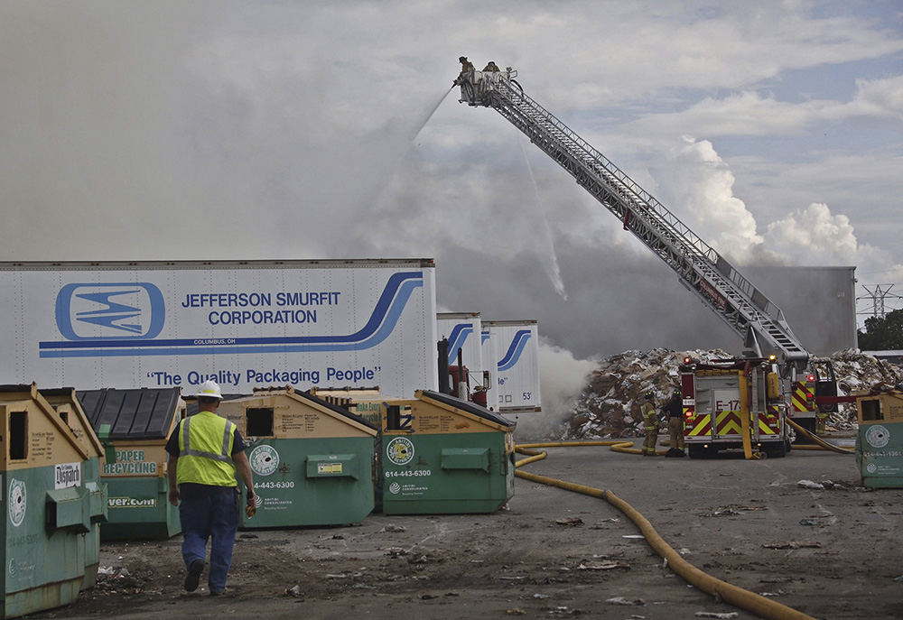 Spot News - 3rd place - Columbus firefighters battle a four-alarm fire at a recycling center on the South Side. Fire officials are advising nearby residents to stay indoors and avoid breathing in the smoke. (Tom Dodge / The Columbus Dispatch)