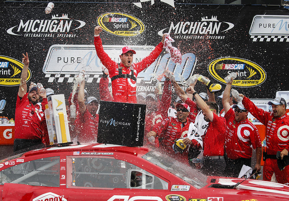 Story - 2nd place - Kyle Larson celebrates with his Target Chevrolet team after winning the NASCAR Sprint Cup Series Pure Michigan 400 at Michigan International Speedway in Brooklyn, Mich. (Andy Morrison / The (Toledo) Blade)