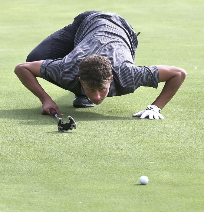 Sports Feature - 2nd place - Perry's Ryan Leininger lines up his putt on the fourth hole during a match with Canton McKinley at The Legends of Massillon. (Scott Heckel / The Repository)