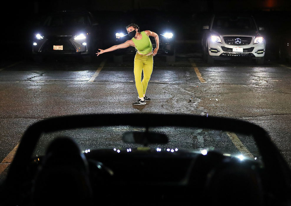 General News - HM - Annie Morgan performs a dance duet titled "Jigsaw" during a parking lot performance put on by GroundWorks Dance Theater in Akron. Jeff Lange / Akron Beacon Journal