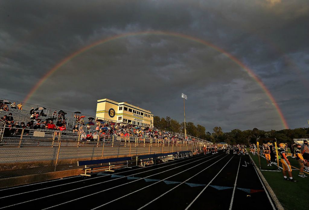 Sports Feature - 2nd place - A rainbow forms over Springfield Stadium during the Wildcats first game of the season against Wayne. Bill Lackey / Springfield News-Sun