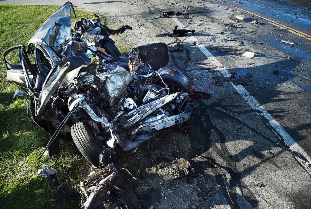 Spot News - 1st place - A Pontiac Grand Prix heading southbound on US 127 reportedly went left to center colliding with a semitrailer heading north at the intersection of US 127 and Shelley Rd, northeast of Rockford.  Daniel Melograna / The Daily Standard