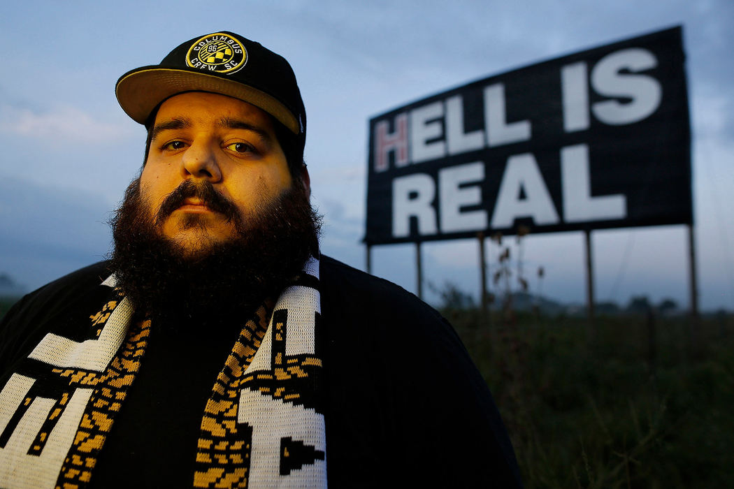 Portrait - 3rd placeTony Galiffo designed the first Hell Is Real scarf and poses in front of the Hell Is Real billboard on I-71 in Mount Sterling. The Columbus Crew will take on Cincinnati FC in the first "Hell is Real" game later this month.   (Kyle Robertson / The Columbus Dispatch)