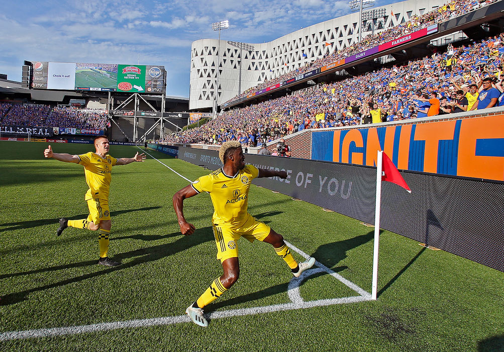 Story - 3rd placeColumbus Crew SC forward Gyasi Zardes (11) celebrates his first goal by punching the corner flag against FC Cincinnati during the first half of their MLS game at Nippert Stadium in Cincinnati. (Kyle Robertson / The Columbus Dispatch)