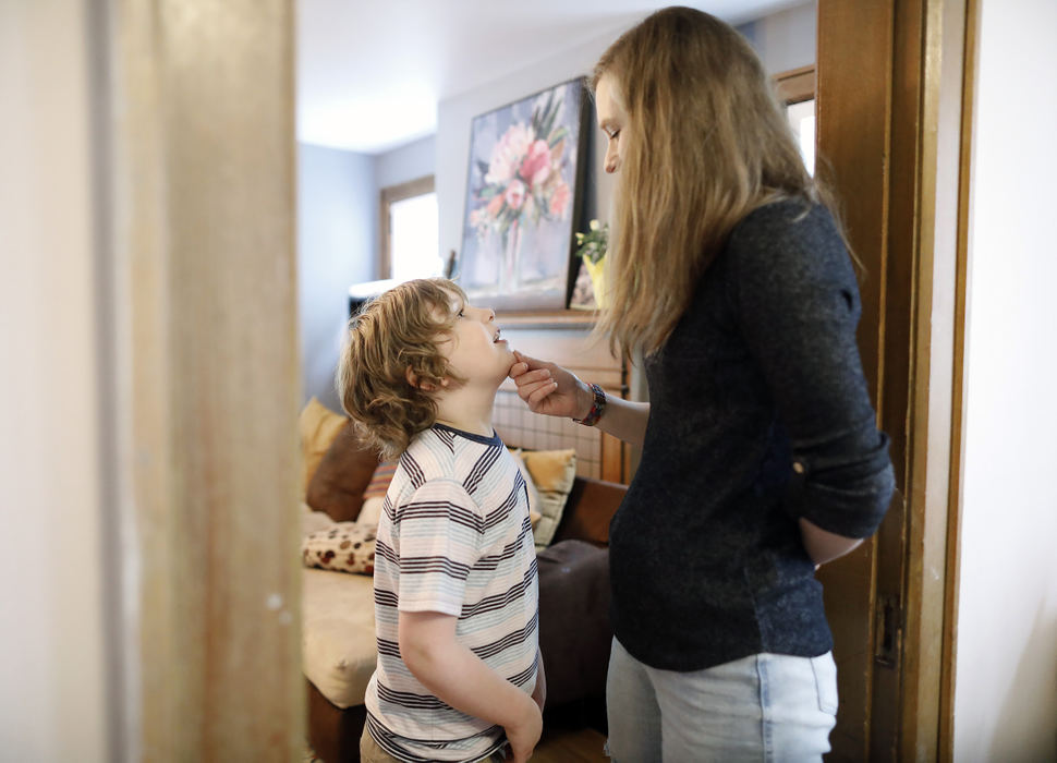 General News - 1st place - Including in this year’s state budget is an additional funding for children with a diagnosis of autism to access educational services from a specialized provider like Bridgeway Academy and others around the state. Melissa Peppercorn takes a moment and talks to her son Mikey Heine, 8, before his first day of school at Bridgeway Academy. (Kyle Robertson / The Columbus Dispatch)