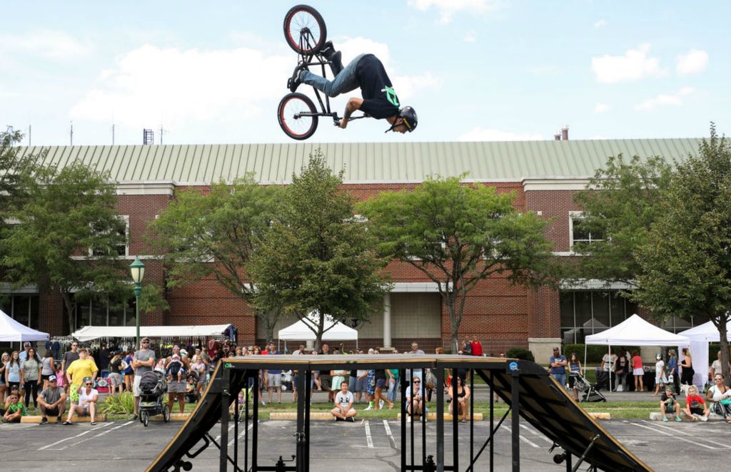 General News - HM - Oregon resident John King tries a flip in a BMX demonstration by The Right Direction during the Maumee Summer Fair in downtown Maumee. King was unsuccessful on this attempt. (Kurt Steiss / The Blade)