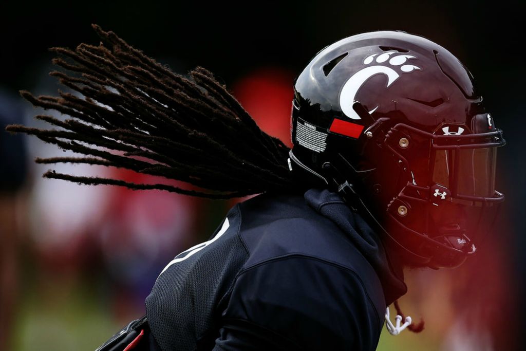 Sports Feature - HM - Cincinnati Bearcats cornerback Arquon Bush (9) catches a throw in a drill during practice at the Higher Ground training facility in West Harrison, Ind. (Sam Greene / The Cincinnati Enquirer)