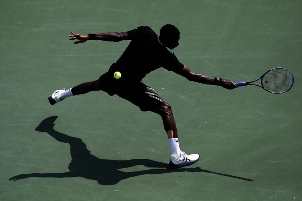 Sports - 3rd place - Gael Monfils returns a shot in the first set of a match against Andrey Rublev in the Western & Southern Open at the Lindner Family Tennis Center in Mason. (Sam Greene / The Cincinnati Enquirer)