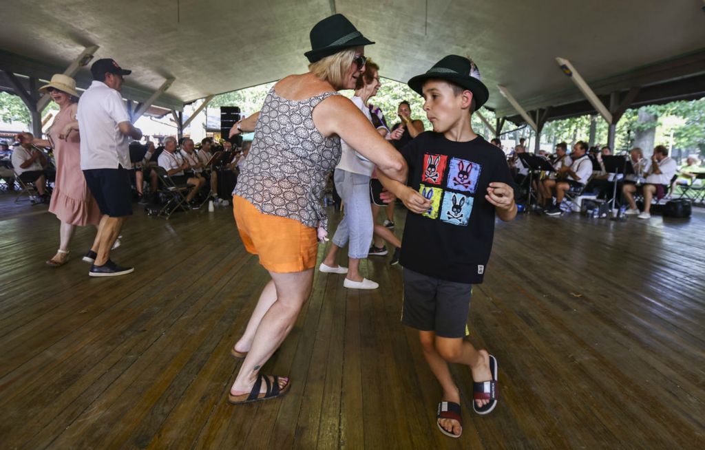 Story - 1st place - Millie Hopes of Toledo dances with her boyfriend’s son Mason Durkee, 8, of Royal Oak, Michigan, during the German-American Festival at Oak Shade Grove in Oregon.  (Jeremy Wadsworth / The Blade)