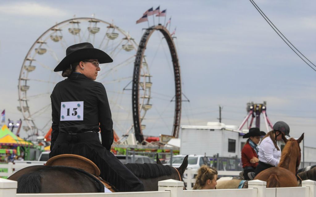 Story - 1st place - Julianna Stratton, 18, of Dearborn, Michigan, rides her quarter horse “Jettin2Vegas” at the Monroe County Fair in Monroe, Michigan.   (Jeremy Wadsworth / The Blade)