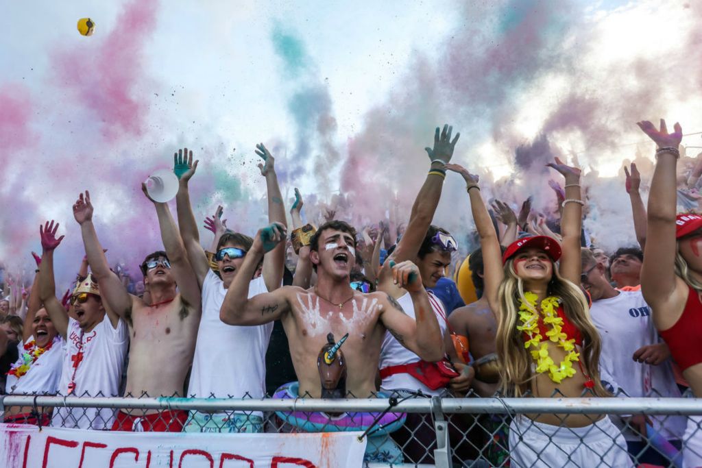 Sports Feature - 2nd place - The Whitmer Panthers student section roars after the opening kickoff against the Central Catholic Fighting Irish at Whitmer High School in Toledo. (Isaac Ritchey / The Blade)