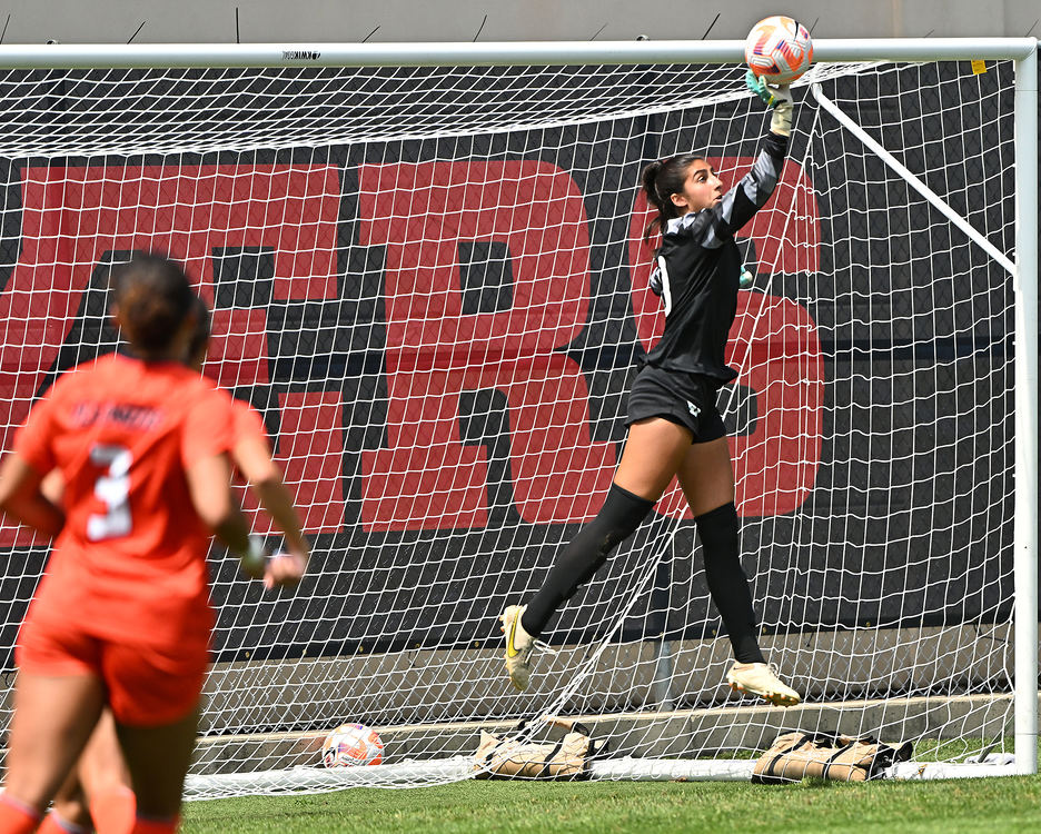 Sports - 3rd place - Dayton's Goalie Batoul Reda deflects a shot on goal by Illinois. The two teams battled to a 0-0 draw at Baujan Field in Dayton. (Erik Schelkun / Elsestar Images)