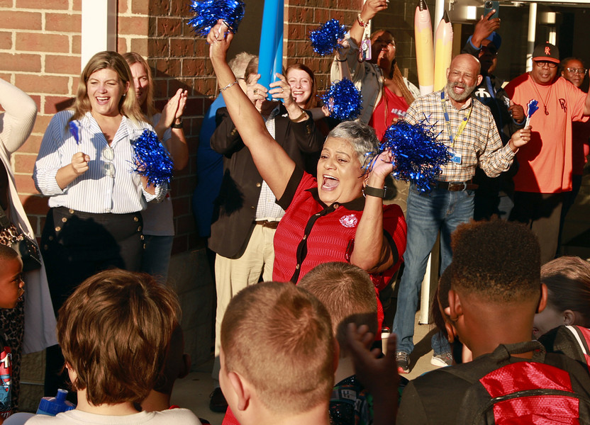 General News - 3rd place - Fulton Elementary School Principal Deborah Howard celebrates with members of the community during a "Fulton First Day Clap-in" for the students as they arrive at school.  (Bill Lackey / Springfield News-Sun)   (Bill Lackey / Springfield News-Sun)