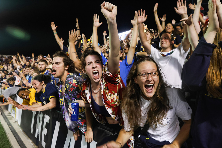 Sports Feature - 1st place - The University of Toledo’s student section celebrates a touchdown during the Rockets’ home opener football game at the Glass Bowl in Toledo. (Rebecca Benson / The Blade)   (Rebecca Benson / The Blade)