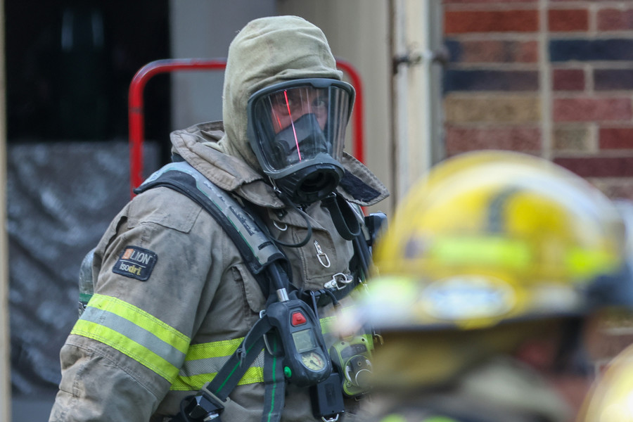 Spot News - 2nd place - A Toledo Firefighter exits a home at 1948 Clarenden Drive after extinguishing a small fire. (Jonathan Aguilar / The Blade)   (Jonathan Aguilar / The Blade)