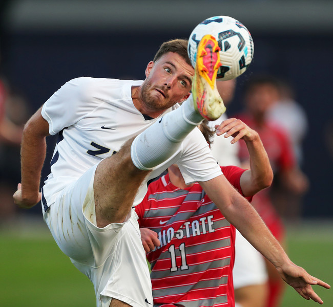 Sports - 2nd place - University of Akron forward Victor Gaulmin keeps his eyes on the ball during the first half of a match against Ohio State in Akron. (Jeff Lange / Akron Beacon Journal)   (Jeff Lange / Akron Beacon Journal)