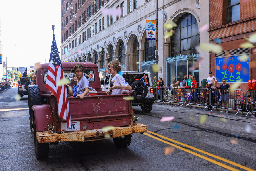 Story - 2nd place - Confetti falls after kids set off a confetti popper during the Jeep Fest parade in downtown Toledo. (Rebecca Benson / The Blade)   (Rebecca Benson / The Blade)