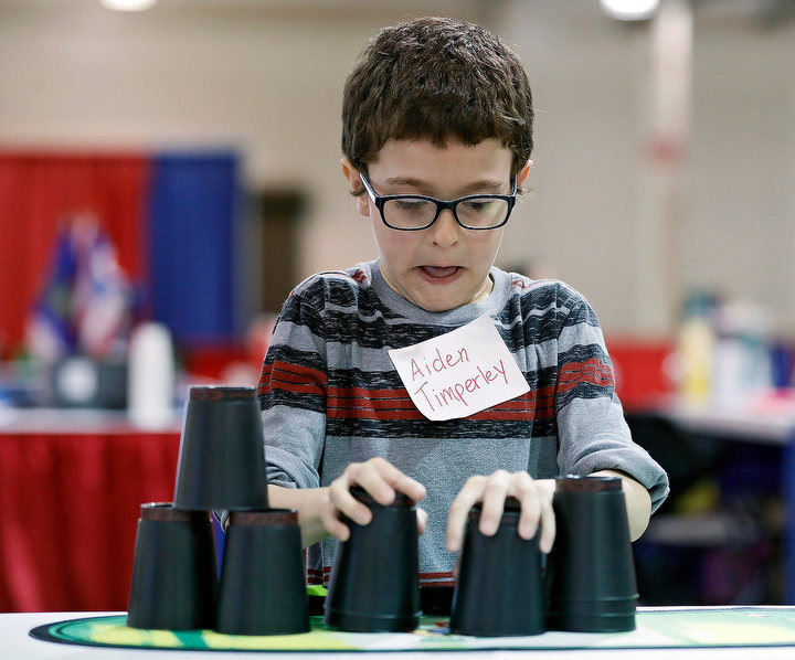 March - 1st place sports - Aiden Timperley, 7, of Columbus stacks and unstacks cup during a Cup Stacking Individual event at Bricker Hall during the Arnold Sports Festival at the Ohio Expo Center in Columbus. (Kyle Robertson / The Columbus Dispatch)