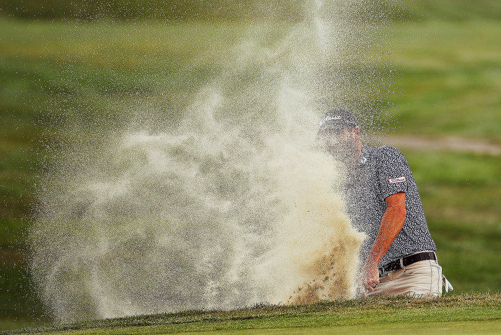 August - 3rd place sports - Nicholas Lindheim tries to hit out of the bunker on the 9th hole during the 3rd round of the 2020 Nationwide Children's Hospital Championship at The Ohio State University Golf Club in Columbus. Lindheim failed and the ball remained in the bunker after the shot. Kyle Robertson / The Columbus Dispatch