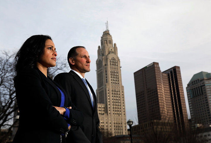 December - 1st place portrait - Assistant U.S. Attorneys Heather Hill and Brian Martinez poses for a photo outside the Federal courthouse in Columbus. The married couple juggles heavy prosecutions and home life.  Kyle Robertson / The Columbus Dispatch