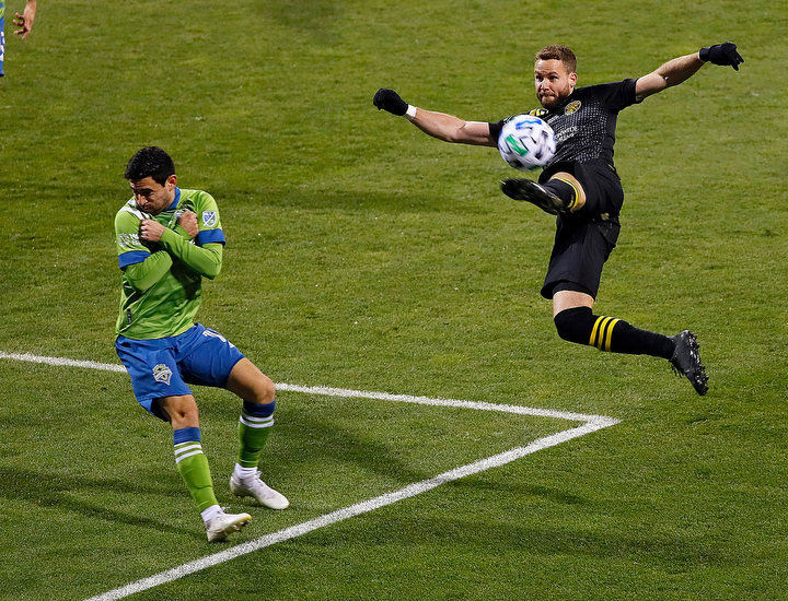 December - 1st place story - Columbus Crew SC defender Josh Williams (3) goes up for a volley against Seattle Sounders FC midfielder Alex Roldan (16) off a corner kick during the first half of the 2020 MLS Cup at MAPFRE Stadium in Columbus. Kyle Robertson / The Columbus Dispatch