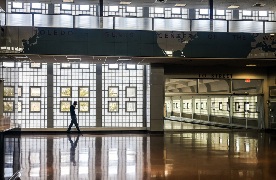 February -  Feature - 3rd place - David Zavac, regional representative for U.S. Rep. Marcy Kaptur, talks on a phone while walking through the train station during a presentation from All Aboard Ohio and TMACOG on the importance of passenger rail development in Toledo.  (Jeremy Wadsworth / The Blade)}