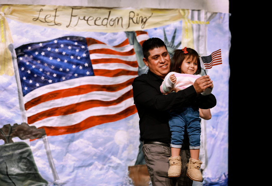 March - General News - 1st place - Arturo Garcia, originally from Mexico, celebrates becoming a U.S. citizen with his daughter Arysa, 2, during a Naturalization Ceremony at Sylvania Southview High School in Sylvania.  (Jeremy Wadsworth / The Blade)