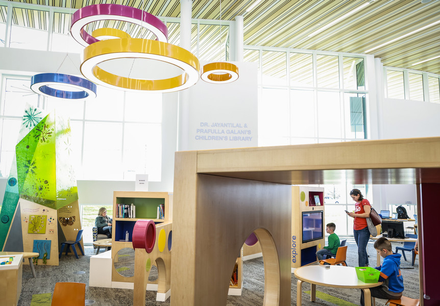 March - General News - 2nd place - Joellen Poncheri of Sylvania and her sons (from left) Christopher, 6, and Dominic, 8, explore the freshly renamed Dr. Jayantilal & Prafulla Galani’s Children’s Library inside the King Road Branch Library in Sylvania.   (Jeremy Wadsworth / The Blade)