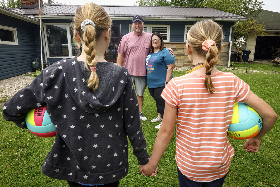 May - Portrait - 1st place - Ray and Kati Tittle with their foster children, K.S. and S.S.  in Fremont.  (Jeremy Wadsworth / The Blade)  