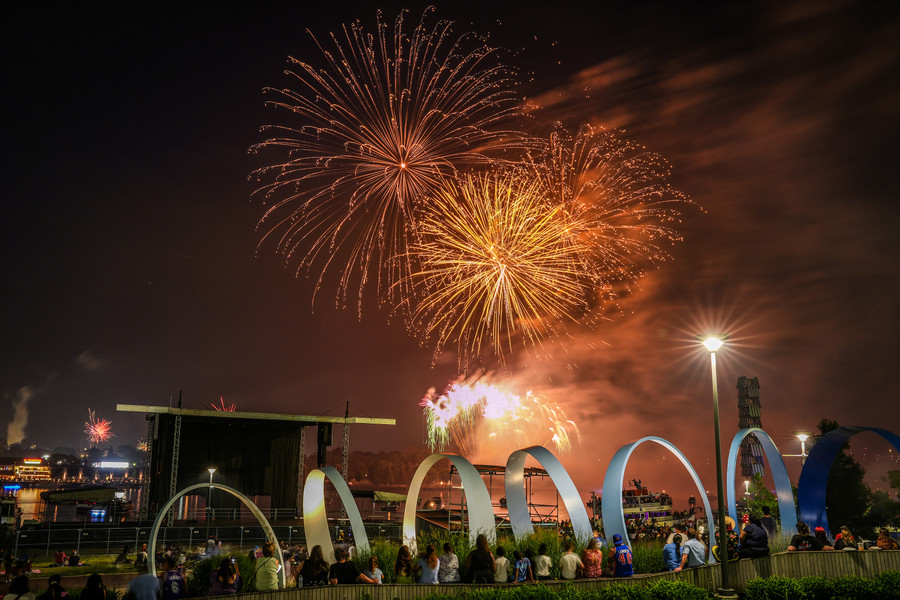 July - Feature - 2nd place - People watch the July 4th fireworks display at Promenade Park in Toledo. (Jeremy Wadsworth / The Blade)