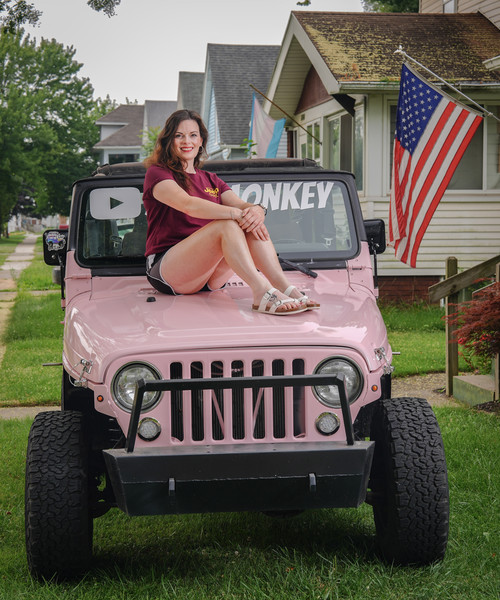 July - Portrait - 3rd place - Jillion Merricle with her Jeep she named "Bazooka" in Toledo.  (Jeremy Wadsworth / The Blade)