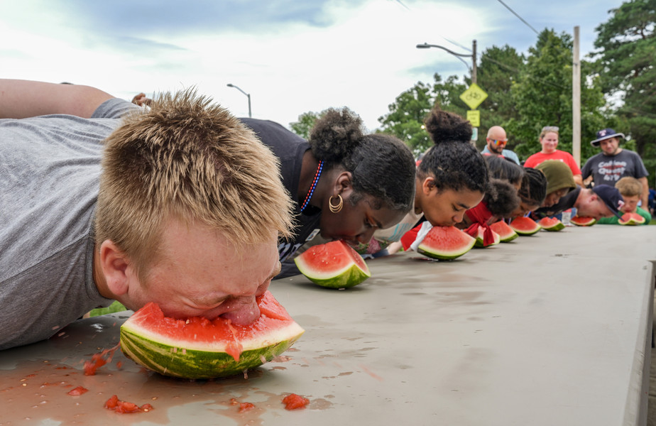 July - Story - 3rd place - Parker Williamson, 14, of Toledo competes in the annual watermelon eating contest during the Harvard Circle Fourth of July 4th Celebration at Walbridge Park in Toledo. (Jeremy Wadsworth / The Blade)