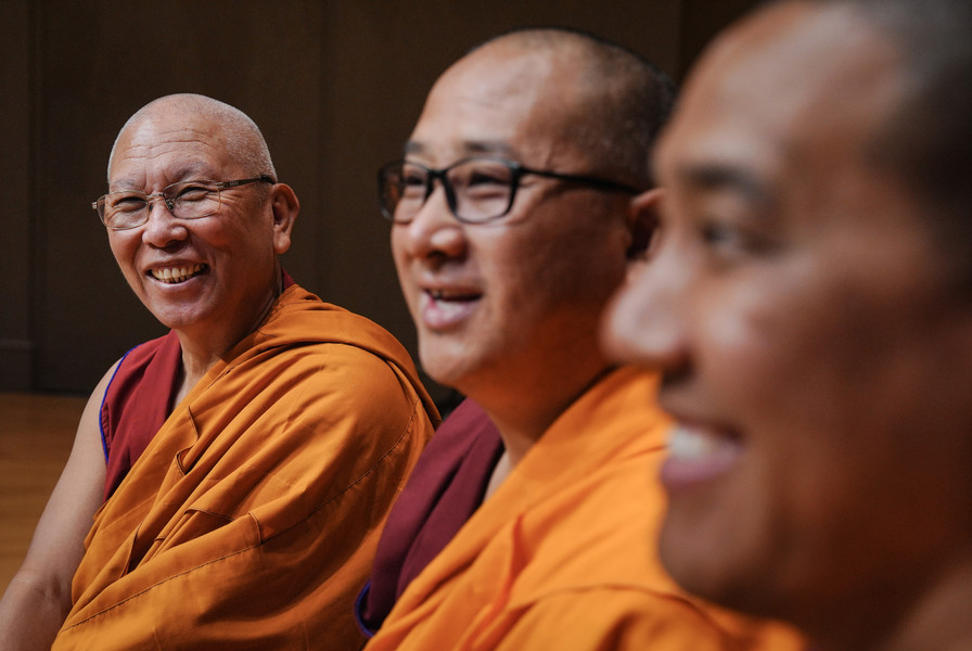 September - Portrait - 1st place - Gaden Shartse Monastery monk Venerable Geshe Lharampa Kunchok Tashi Bhutia (left) smiles during a forum at Bluffton University in Bluffton. (Jeremy Wadsworth / The Blade)