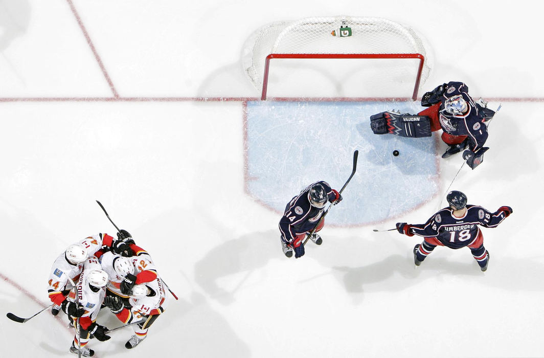 Sports - 2nd place - Jarome Iginla (12) celebrates with his teammates after scoring on Columbus Blue Jackets goalie Steve Mason (1) in the 3rd period during their NHL game at Nationwide Arena in Columbus. (Kyle Robertson / The Columbus Dispatch)