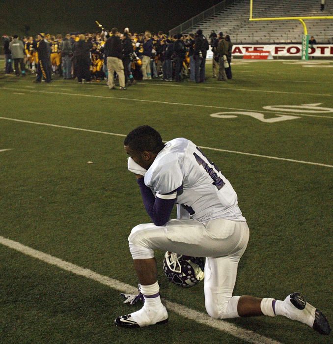 Story - 3rd place - Pickerington Central Marcus Milton can't watch Saint Ignatius celebrate their championship in the Division I championship game at Fawcett Stadium in Canton. (Kyle Robertson / The Columbus Dispatch)